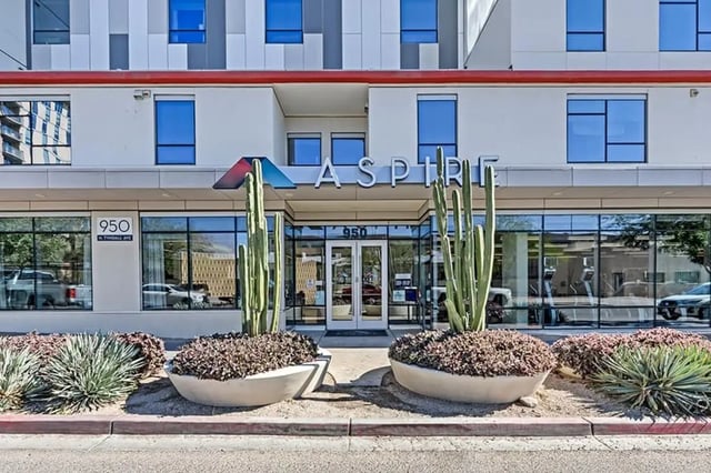 Aspire building entrance with large cacti exterior at Aspire Tucson Apartments in Tucson Student Accommodation