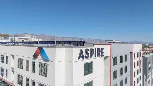 Aspire building with logo and windows exterior at Aspire Tucson Apartments in Tucson Student Accommodation