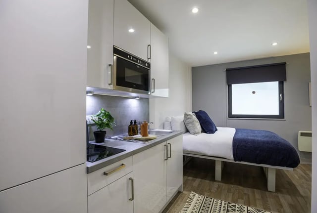Kitchenette with microwave and bed studio at The Bridge Phase II in Newcastle Upon Tyne Student Accommodation