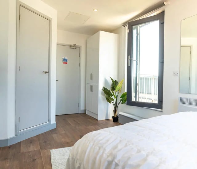 Doors wardrobe plant open window bedroom at The Bridge Phase II in Newcastle Upon Tyne Student Accommodation