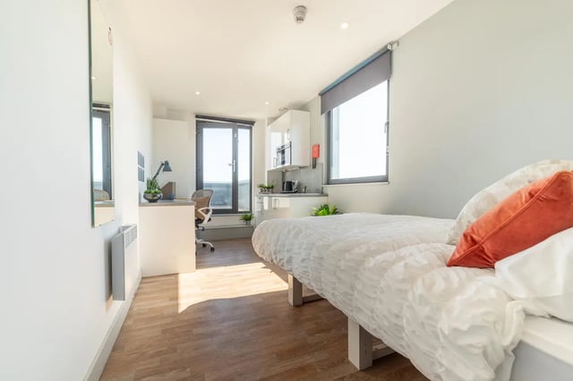 Bed desk and kitchenette area studio apartment at The Bridge Phase II in Newcastle Upon Tyne Student Accommodation