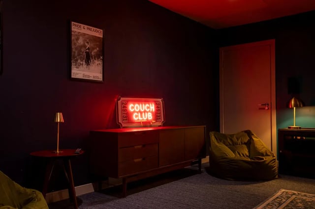Beanbag poster neon sign cabinet side table living room at The Bridge Phase II in Newcastle Upon Tyne Student Accommodation