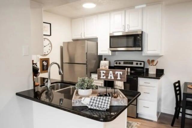 Kitchen with refrigerator microwave stove sink kitchen area at Cedar Flats Student Housing in St. George Student Accommodation
