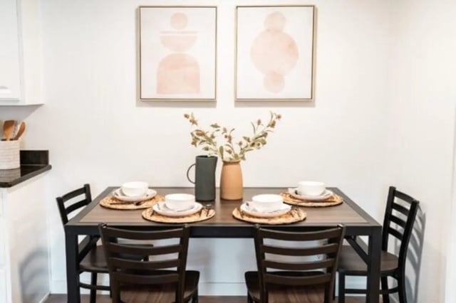 Dining table with four place settings and art dining area at Cedar Flats Student Housing in St. George Student Accommodation