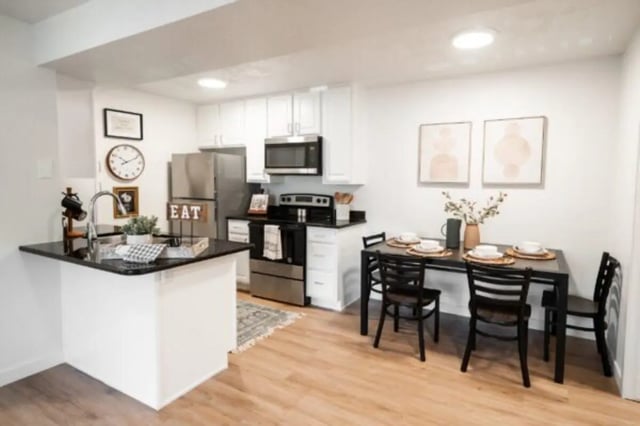 Kitchen with island table chairs and appliances kitchen at Cedar Flats Student Housing in St. George Student Accommodation