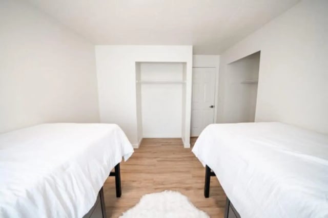 Two beds, closet, door bedroom at Cedar Flats Student Housing in St. George Student Accommodation
