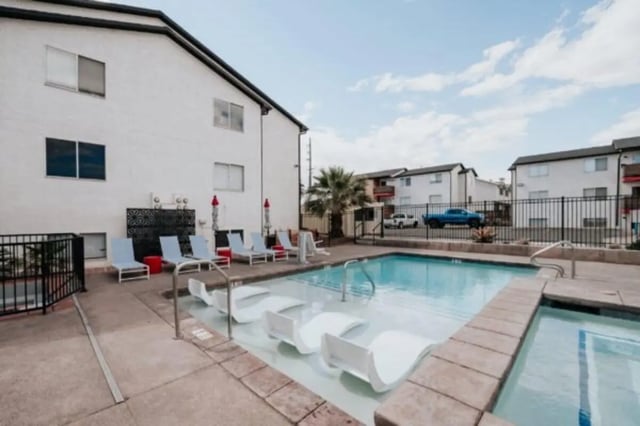 Swimming pool with lounge chairs exterior at Cedar Flats Student Housing in St. George Student Accommodation