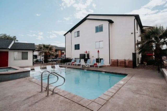 Pool lounge chairs building exterior image at Cedar Flats Student Housing in St. George Student Accommodation
