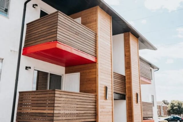 Balconies with wooden railings and red awnings exterior at Cedar Flats Student Housing in St. George Student Accommodation