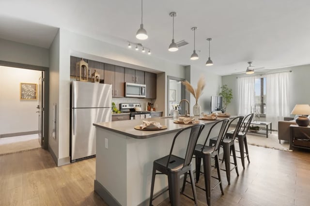 Modern kitchen island with seating and appliances kitchen at The Yard in Ann Arbor Student Accommodation