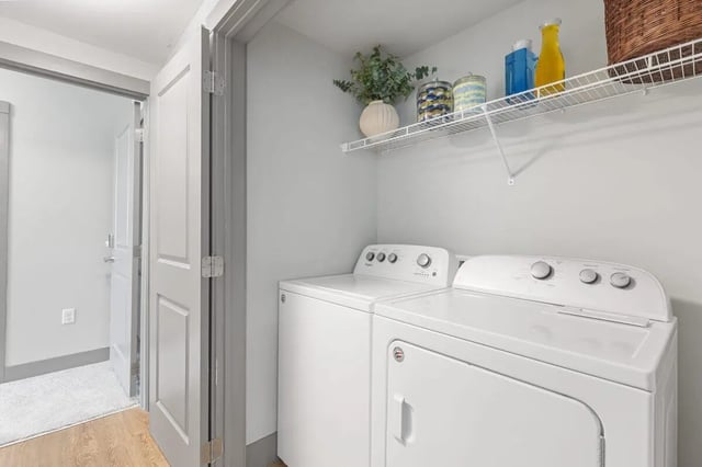 Two white washers on shelf laundry room at The Yard in Ann Arbor Student Accommodation
