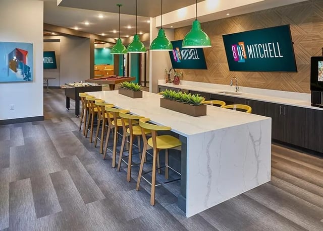 Large counter with stools pool table and foosball living room at 848 Mitchell in Arlington Student Accommodation