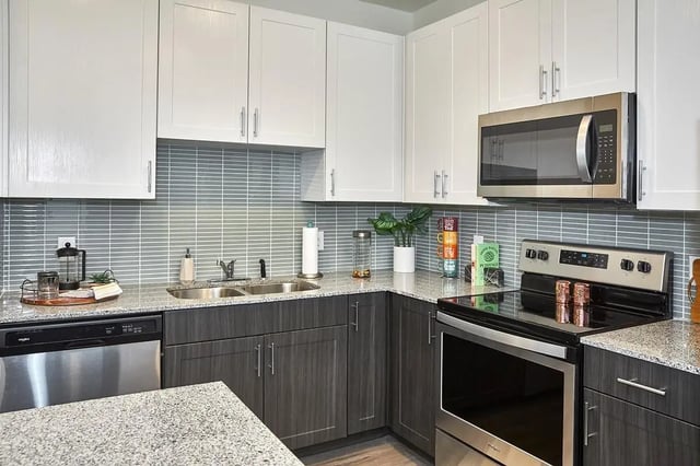 Stainless steel appliances modern cabinets tiled backsplash kitchen at 848 Mitchell in Arlington Student Accommodation