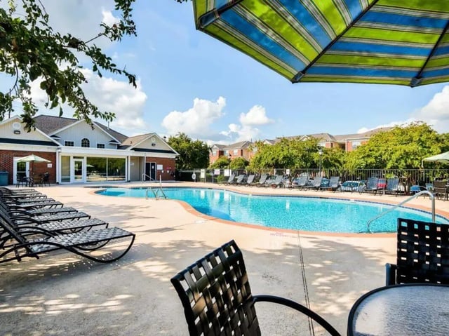 Pool lounge chairs and tables recreation area at Campus Pointe in Kent Student Accommodation
