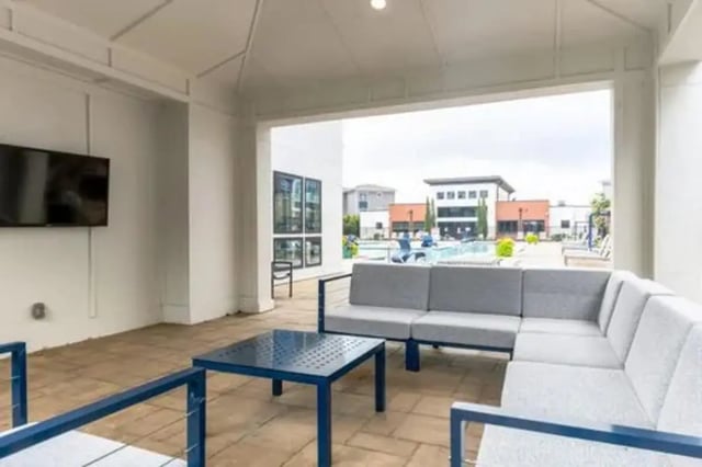 Sofa coffee table and TV outdoor lounge area at URSA in Waco Student Accommodation