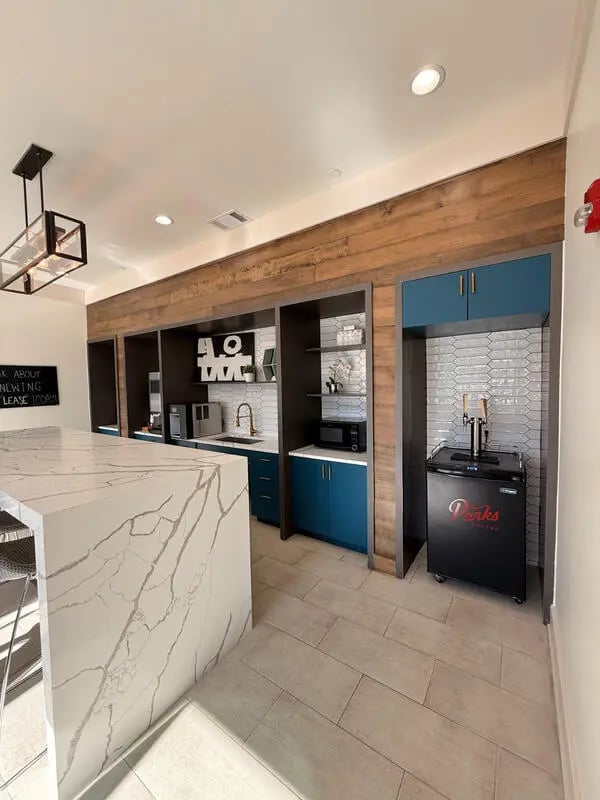 Marble island with beer dispenser kitchen at URSA in Waco Student Accommodation
