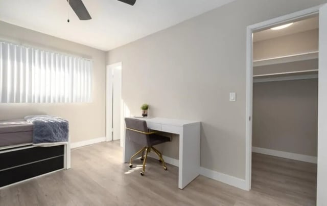 Bed desk chair open closet bedroom at USC Student Housing: Heritage 2353 in Los Angeles Student Accommodation