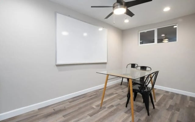Glass table chairs whiteboard study area at USC Student Housing: Heritage 2353 in Los Angeles Student Accommodation