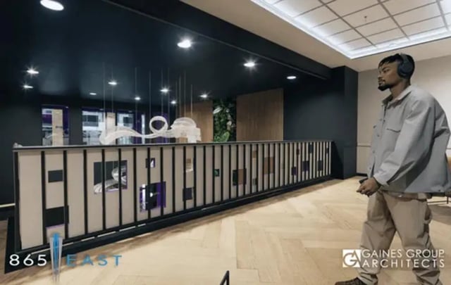 Modern reception area with decorative railing and artwork common area at 865 East in Harrisonburg Student Accommodation