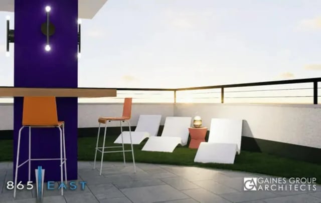 Bar stools lounge chairs outdoor table patio area at 865 East in Harrisonburg Student Accommodation
