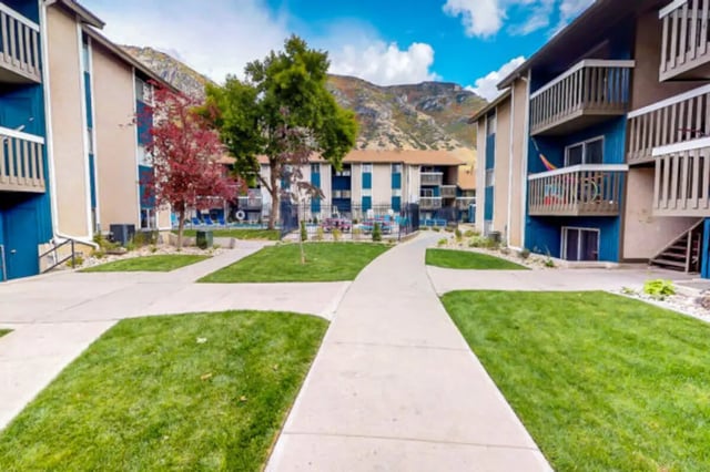 Apartment buildings with balconies and pathways exterior at Centennial Apartments in Provo Student Accommodation