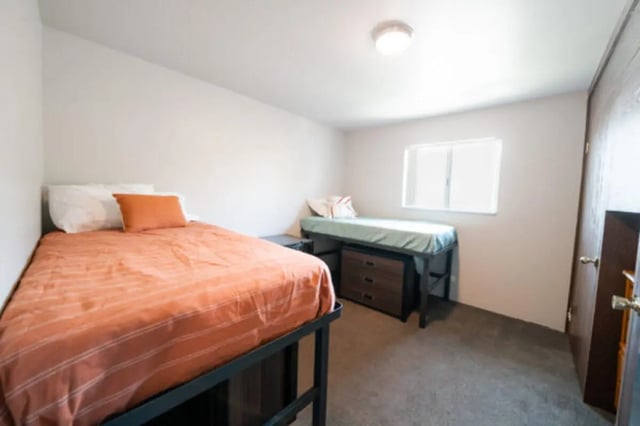 Two beds with drawers and a window Bedroom at Centennial Apartments in Provo Student Accommodation