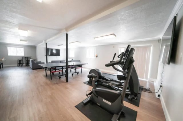 Gym equipment ping pong tables lounge area Recreation room at Centennial Apartments in Provo Student Accommodation
