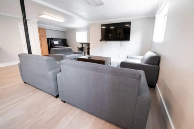 Sofas piano television living room at Centennial Apartments in Provo Student Accommodation