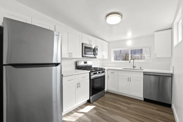 Stainless steel refrigerator stove dishwasher white cabinets kitchen at USC Student Housing: Heritage 631 in Los Angeles Student Accommodation