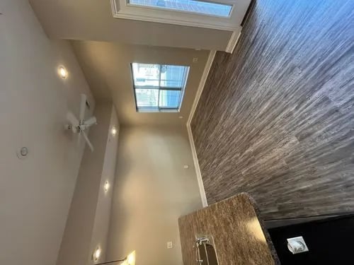 Ceiling fan skylight wood floor kitchen living area at 9 North Apartments in Bloomington Student Accommodation
