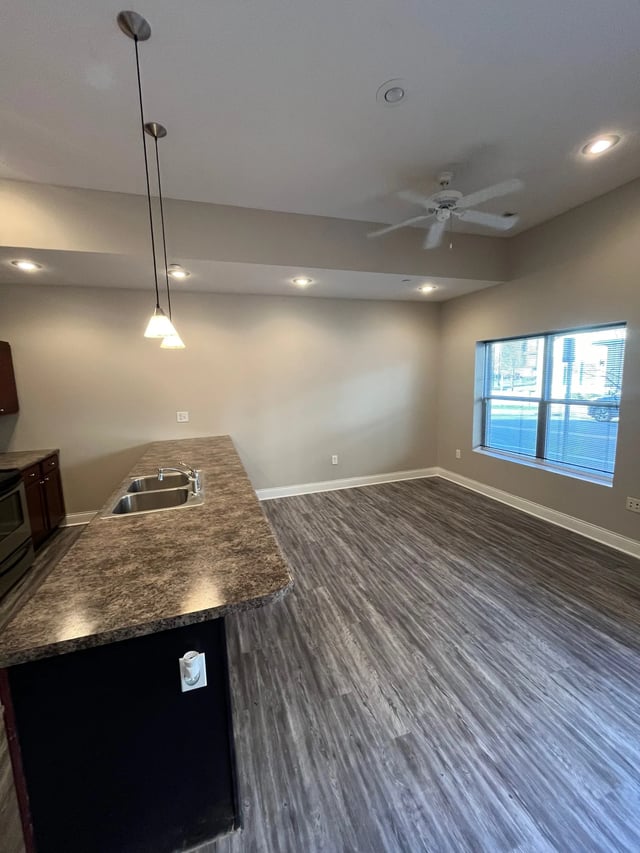 Sink counter ceiling fan window living area kitchen at 9 North Apartments in Bloomington Student Accommodation
