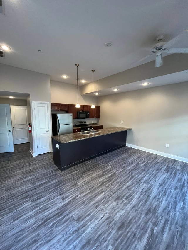 Kitchen island with appliances and doors kitchen at 9 North Apartments in Bloomington Student Accommodation