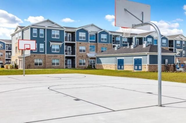 Basketball court with apartment buildings exterior at The Lodge at Allendale in Allendale Student Accommodation
