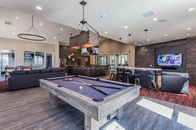 Pool table bar seating and sofas common area at The Lodge at Allendale in Allendale Student Accommodation