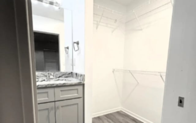 Empty closet next to vanity sink bathroom at Victory Villages in Winston-Salem Student Accommodation