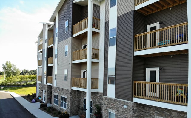Balconies with wooden railings student accommodation exterior at Eight Thirty Water Tower Apartments in Big Rapids Student Accommodation