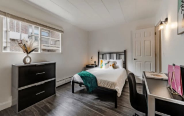 Bed dresser chair and desk Bedroom at Victory at Burcham Woods (731) in East Lansing Student Accommodation