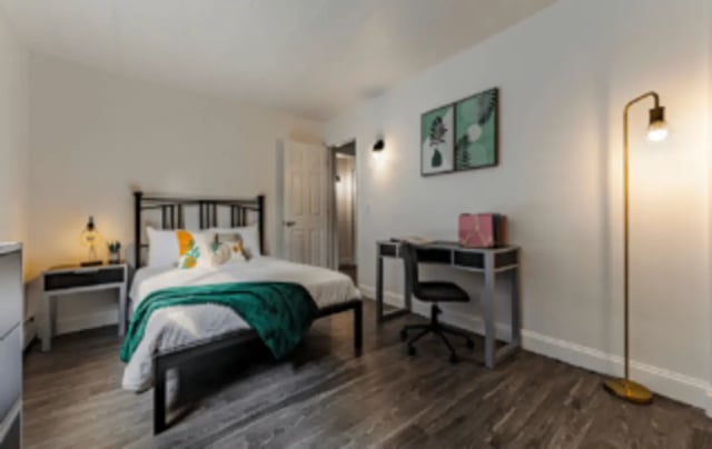 Bed desk chair and floor lamp bedroom at Victory at Burcham Woods (731) in East Lansing Student Accommodation
