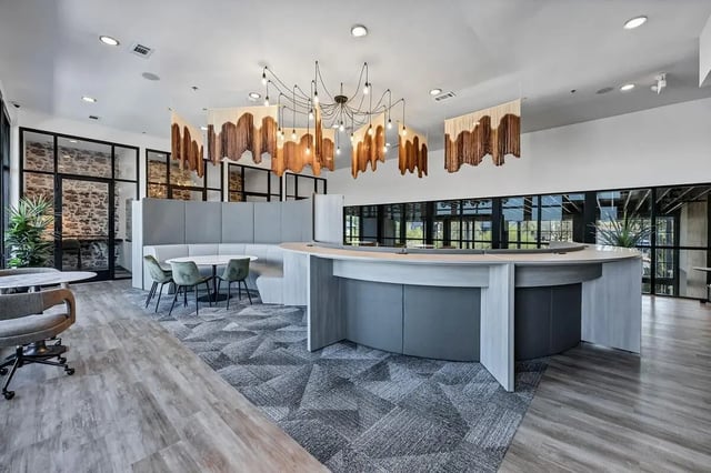 Curved reception desk and seating area communal area at Cottages at San Marcos in San Marcos Student Accommodation