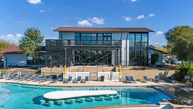 Pool with lounge chairs and swim up bar exterior at Cottages at San Marcos in San Marcos Student Accommodation