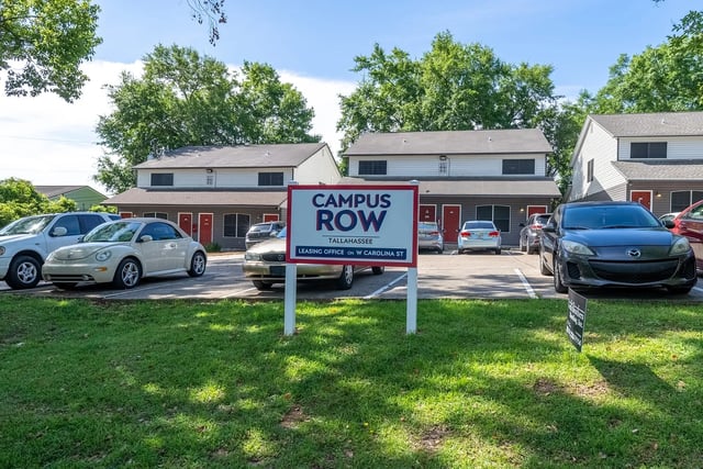 Campus Row sign cars and apartment buildings exterior at Campus Row in Tallahassee Student Accommodation