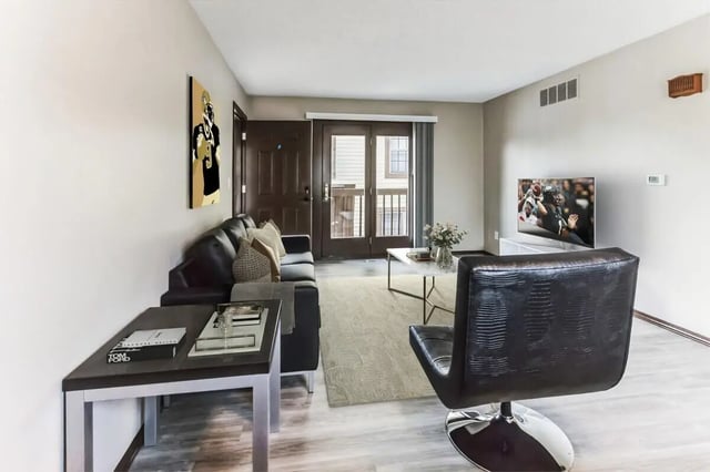 Black sofa coffee table and TV living room at Victory on Salisbury in West Lafayette Student Accommodation