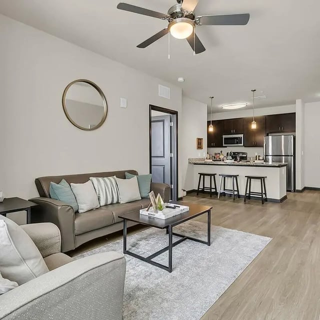 Sofa coffee table and kitchen bar living room at 930 NoMo in Charleston Student Accommodation
