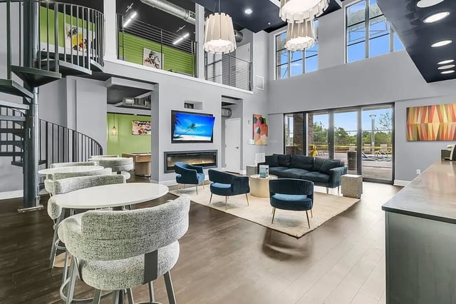 Modern lounge with fireplace sofa and pool table lounge at 930 NoMo in Charleston Student Accommodation