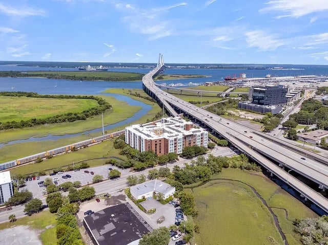 Apartment building with bridge and water exterior at 930 NoMo in Charleston Student Accommodation