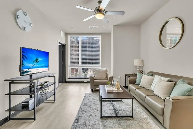 Leather couch coffee table TV living room at 930 NoMo in Charleston Student Accommodation