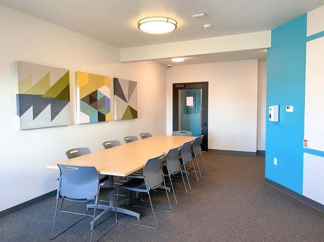 Meeting table and chairs with art study room at 940 North in Spokane Student Accommodation