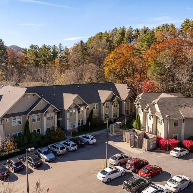 Apartment buildings with parking lot exterior at Boone Student Living in Boone Student Accommodation