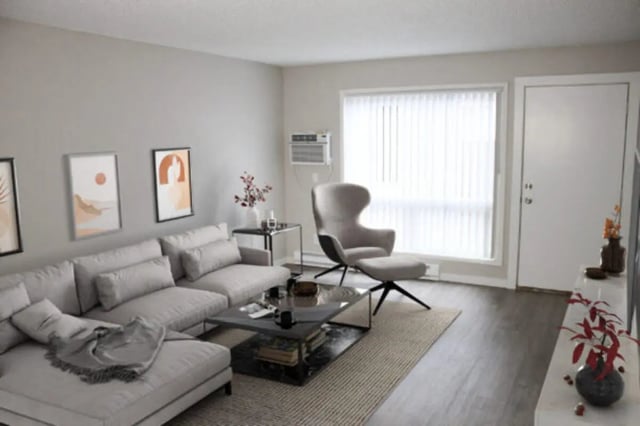Sectional sofa armchair coffee table art living room at Cougar Ridge Apartments in Pullman Student Accommodation