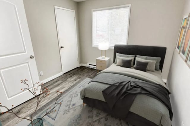 Bed with dark headboard and bedside table Bedroom at Cougar Ridge Apartments in Pullman Student Accommodation